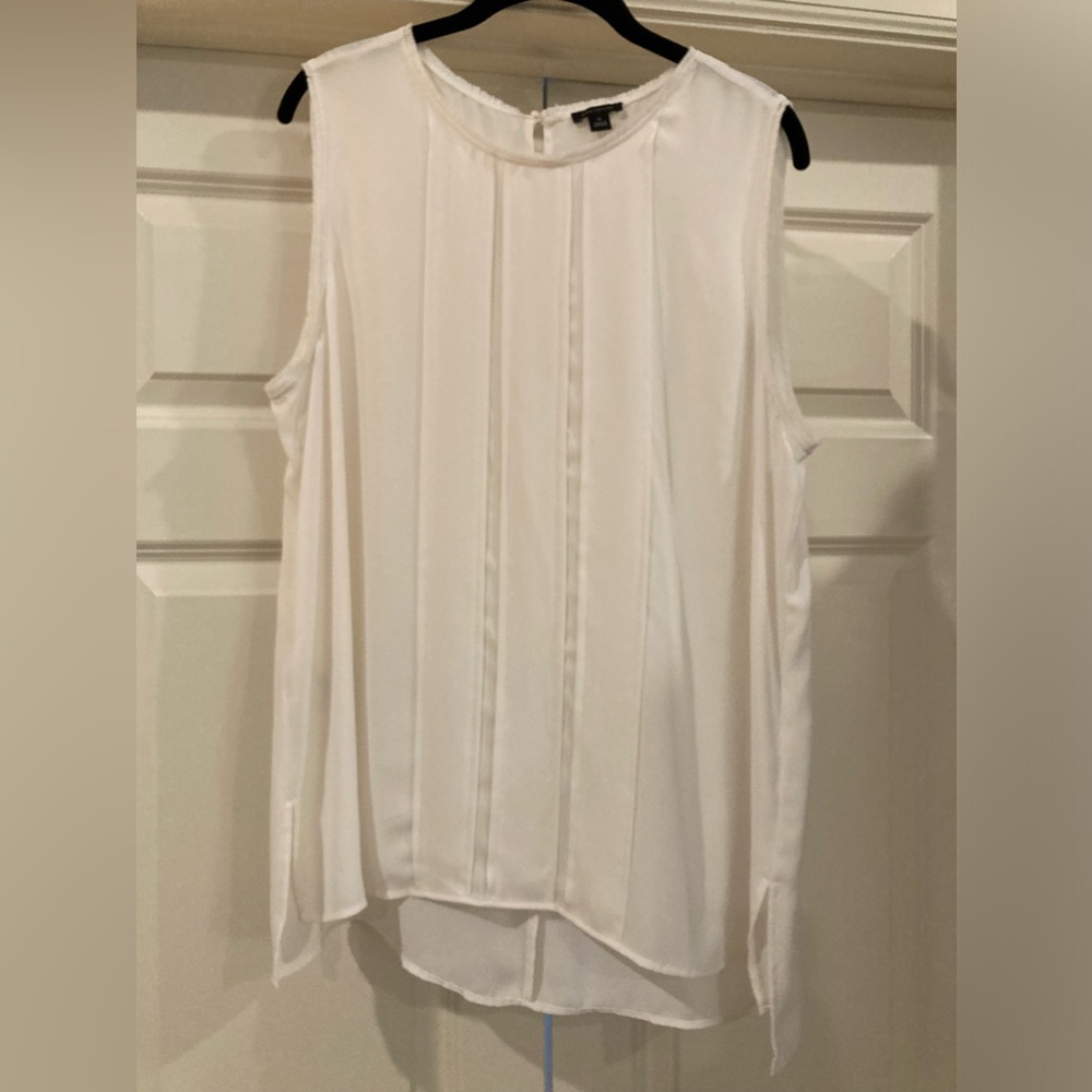 Ann Taylor sleeve less shell with raw edges and front pleats in ivory size XL.
